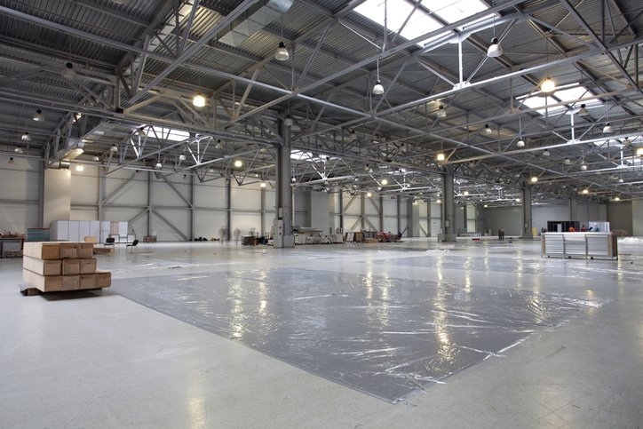 Large modern  exhibition hall that unprepared yet for exhibition but already with some goods